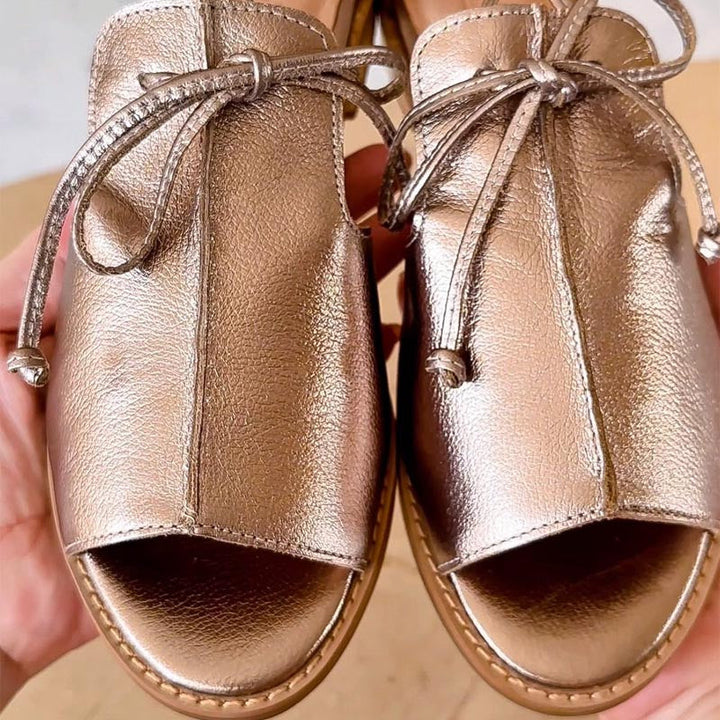 Lilliana | Dirželio Stiliaus Oda Sandalai" could be rewritten as "Lilliana | Leather Sandals with Strap Design.